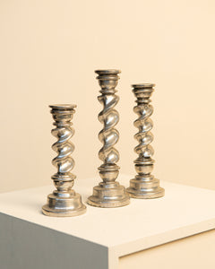 Triptych of twisted aluminum candlesticks 60's